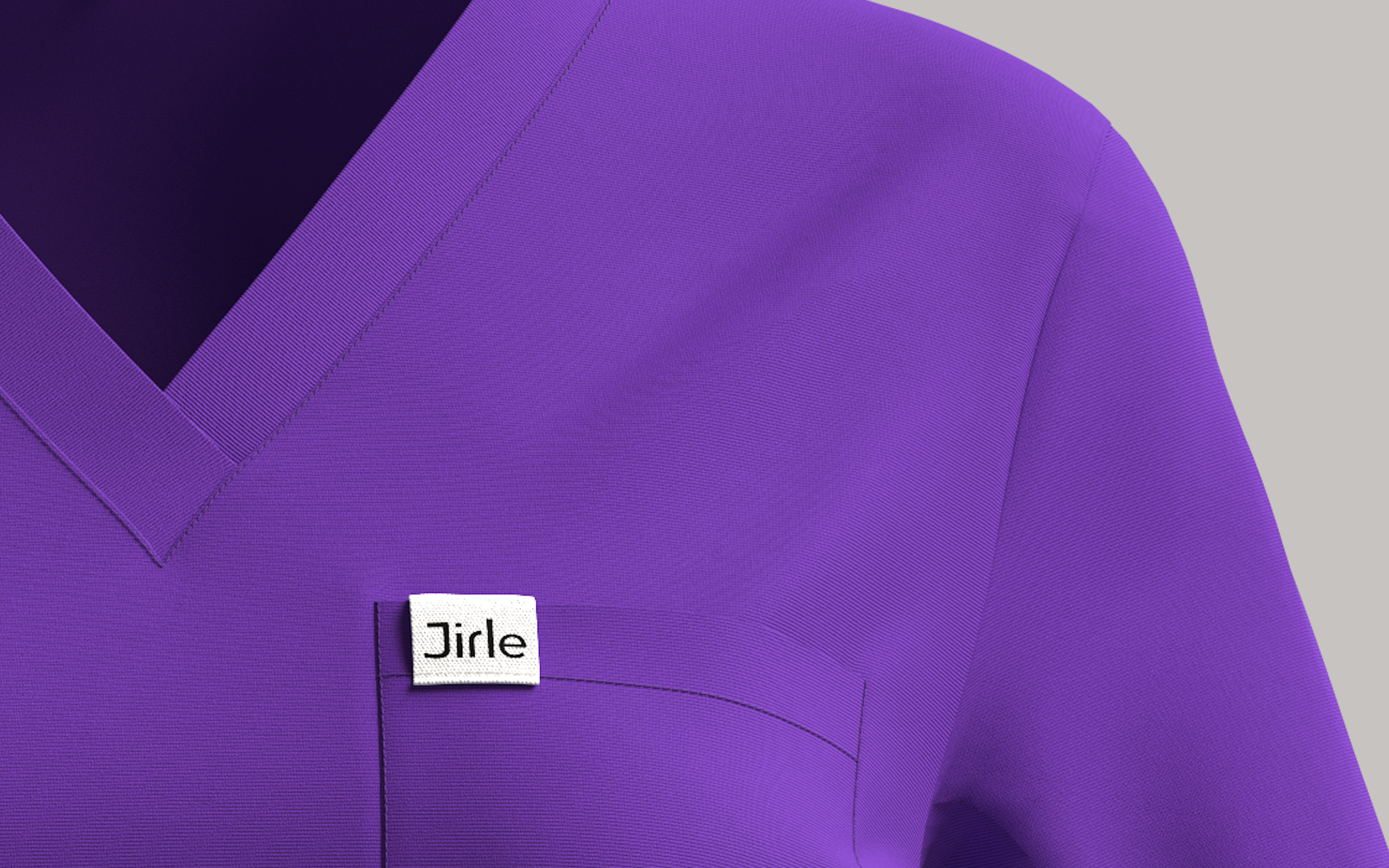 Purple scrub top with a visible brand label on a gray background